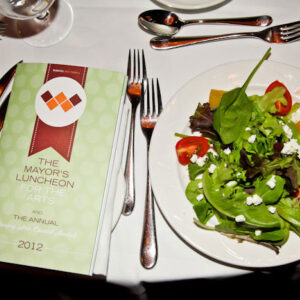 Salad at a place setting.
